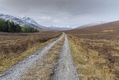 Road amidst landscape against sky