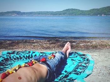 Two people relaxing on beach