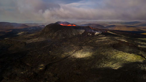 Scenic view of volcanic rock against sky