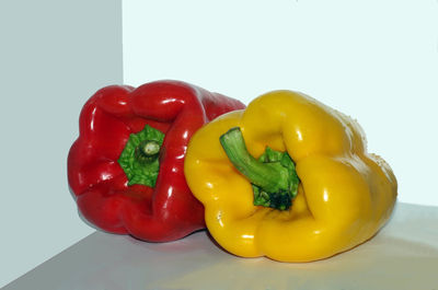Close-up of bell peppers against white background