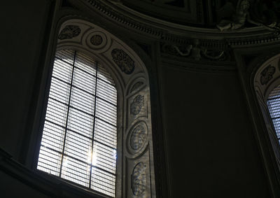 Low angle view of ornate window in building
