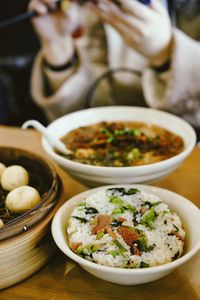 Cropped hand of woman having food