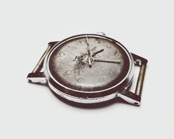 Close-up of clock against white background