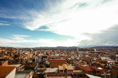 Houses in town against sky