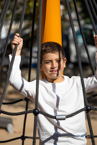 Little kid in a playground on a sunny day