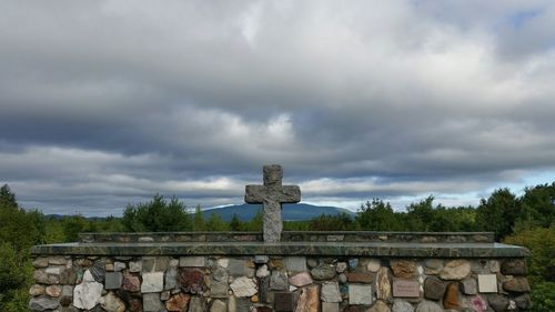 View of old building against cloudy sky