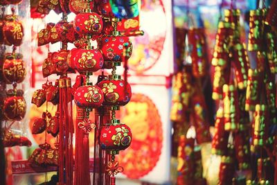 Close-up of lanterns hanging in row for sale
