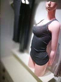 Low section of woman standing on display at store