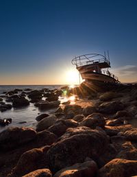 Scenic view of sea against clear sky during sunset