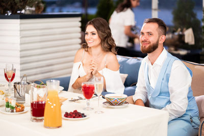 Women sitting on table at restaurant