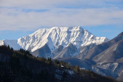 Scenic view of snowcapped mountains against sky