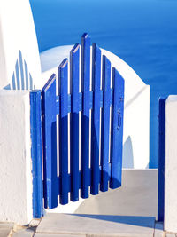 Blue wooden door, entrance to cave house. santorini, cyclades, greece