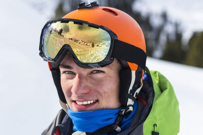 Portrait of smiling man in snow