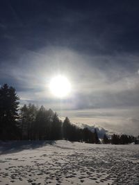 Scenic view of snow covered landscape against sky