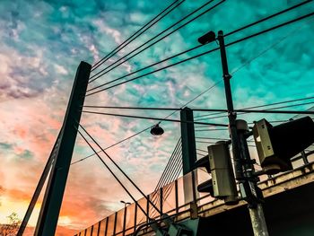 Low angle view of cables against sky