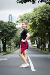 Full length portrait of a girl in city