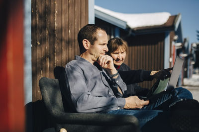 Friends sitting on mobile phone