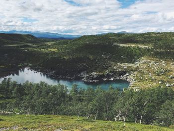 Scenic view of landscape with mountain range in background