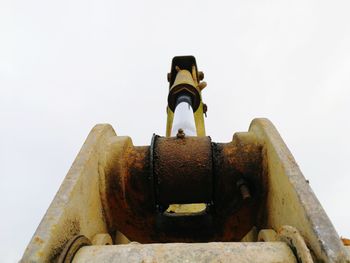 Low angle view of rusty against clear sky