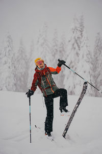 Rear view of girl skiing on snow
