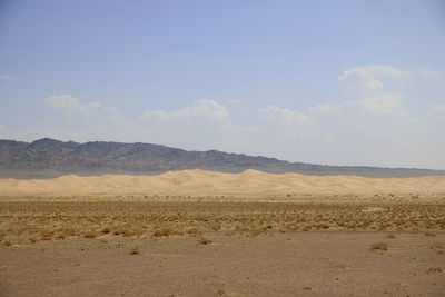 Scenic view of desert against sky