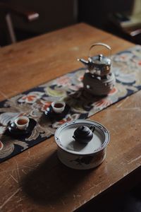 High angle view of teapot on table