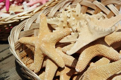 Close-up of dried starfishes for sale at market stall