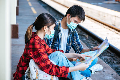 Young couple looking at camera