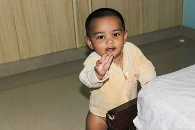 Portrait of cute baby boy at home