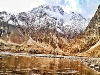 Scenic view of lake and snowcapped mountains during winter