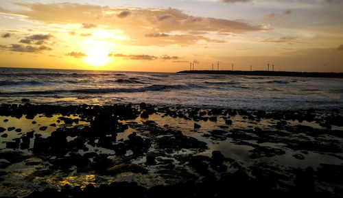 Scenic view of sea against sky during sunset