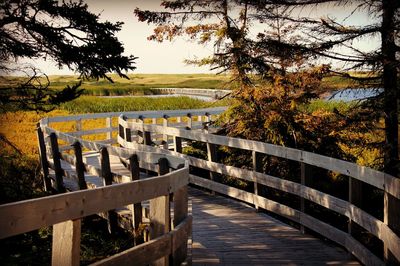 Wooden railing by river