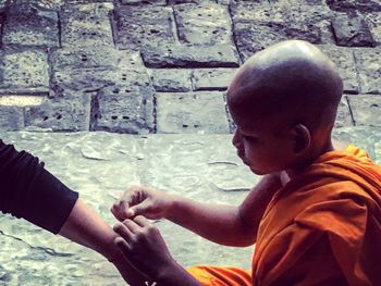 Close-up of woman standing in pond