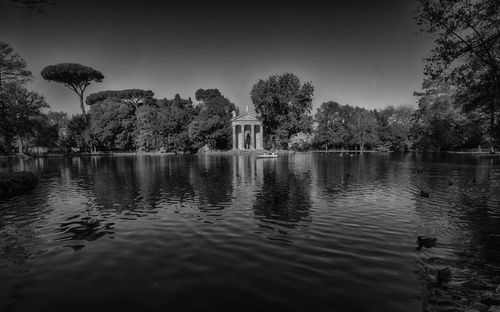 Reflection of trees in lake against sky