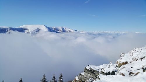 Scenic view of snowcapped mountains against sky