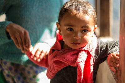 Portrait of cute baby girl at home