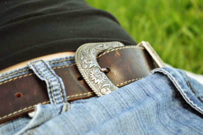 Cropped image of person on grass at park