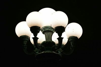 Low angle view of lit lamp