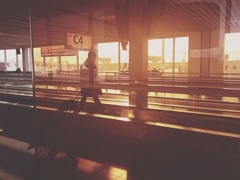 Man sitting by window in city
