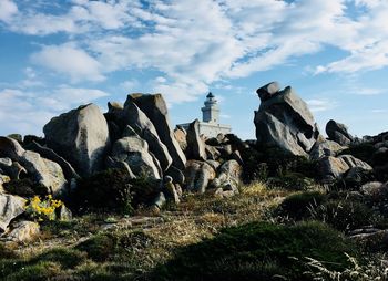 Panoramic view of rocks on land against sky