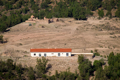 Built structure on landscape against mountain