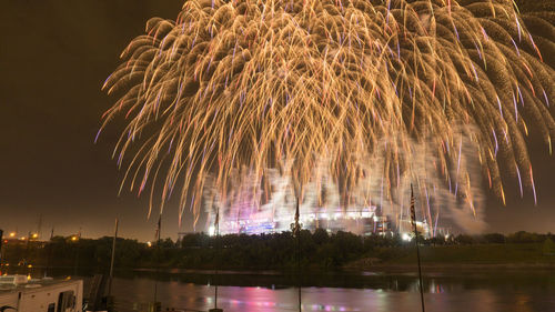 Firework display over city