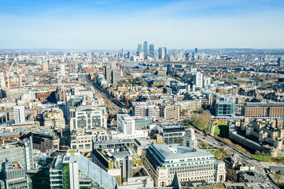 High angle view of buildings in city against sky