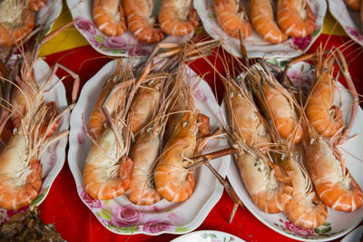 High angle view of cooked shrimps in plate on table