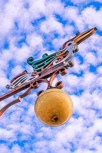 Low angle view of lighting equipment against sky