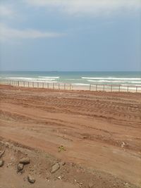 Scenic view of beach against sky