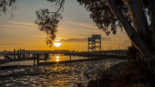 Scenic view of river against orange sky