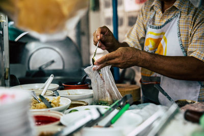 Man preparing food in kitchen