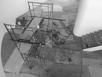 High angle view of broken glass on table against wall