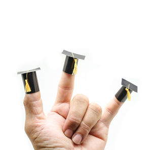 Close-up of hand holding bottle against white background